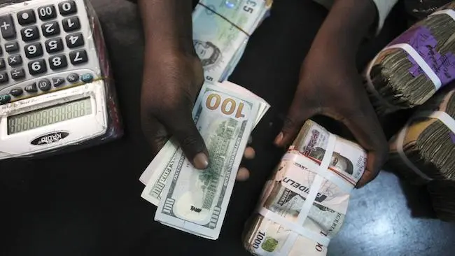 Black market traders make millions as Naira falls to N606/$1