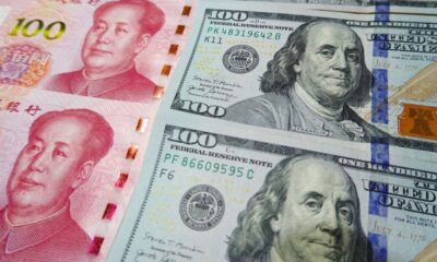 China’s yuan slides to 14-year low against US dollar