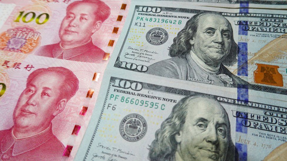 China’s yuan slides to 14-year low against US dollar